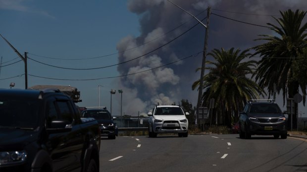 The fire at the Royal National Park viewed from Captain Cook Bridge on Saturday.