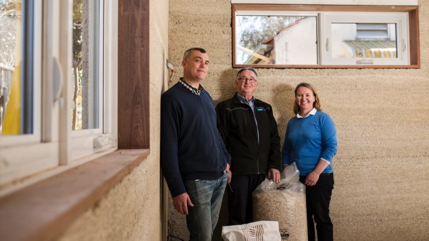 Construction of Canberra's first hemp house. From left, homeowner Rowan Woodburn, Prostyle Building director David Fogg, and Plan It Green designer Angela Knock. 