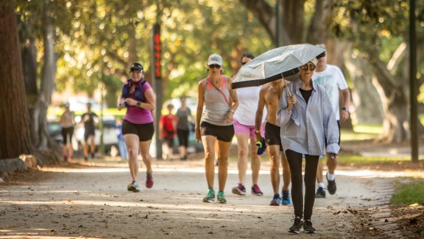 Melburnians got their exercise in early at the Tan before the temperature soared into the 30s.
