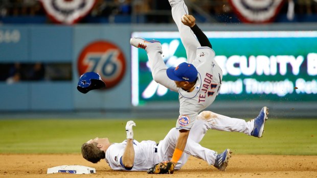 Ruben Tejada is hit by a sliding Chase Utley.