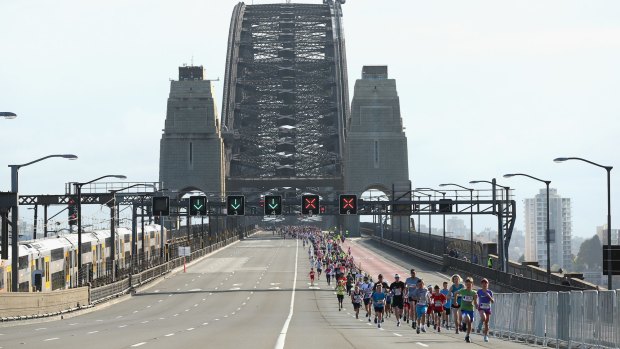Bridge closed: Competitors run in the Sydney marathon during the Blackmores Sydney Running Festival.