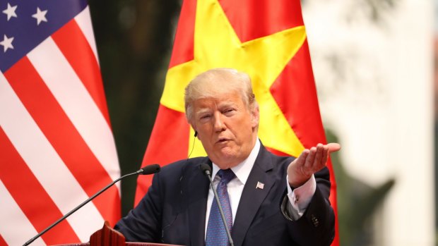 Donald Trump speaks during a news conference at Vietnam's Presidential Palace in Hanoi.