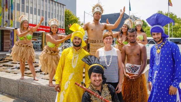 Members of United Nesian Movement and Varis Punjab De dance groups help multicultural affairs minister Rachel Stephen-Smith launch the National Multicultural Festival on Friday.