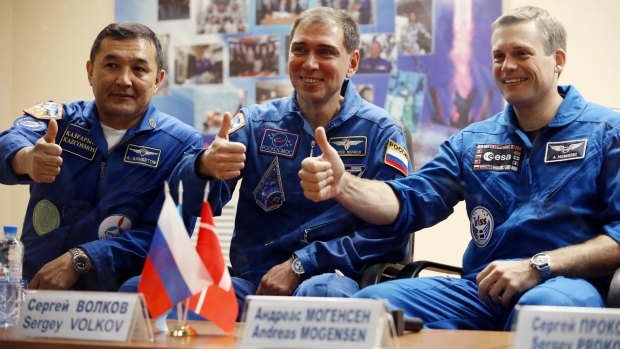 From left: Kazakhstan's cosmonaut Aydyn Aimbetov, Russian cosmonaut Sergei Volkov and Denmark's astronaut Andreas Mogensen on Tuesday.
