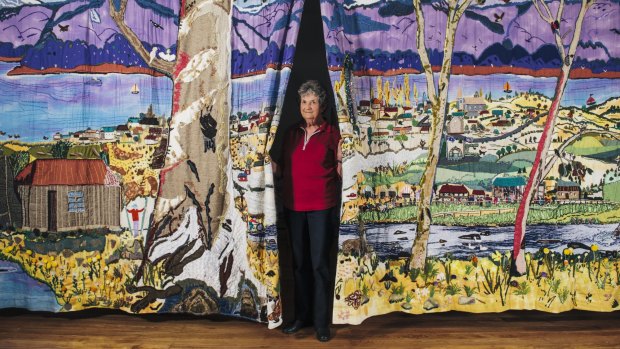 Pam Brayshaw with the Adaminaby Stage Curtain, which will be back on display for tourists.