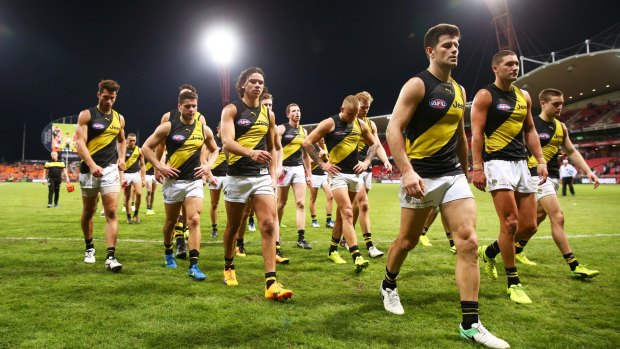 Trent Cotchin and his Tigers teammates look dejected after their loss to Greater Western Sydney.