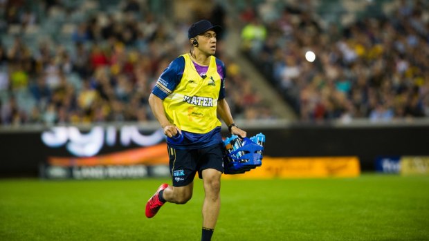 Brumbies' co captain Christian Lealiifano running the water.