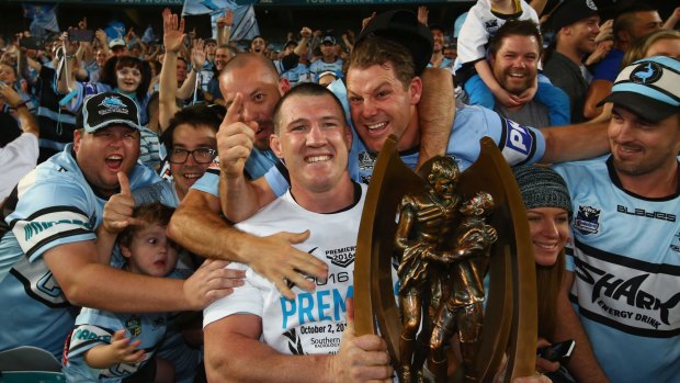 Sweet victory: Paul Gallen is mobbed by Sharks fans after the NRL grand final.