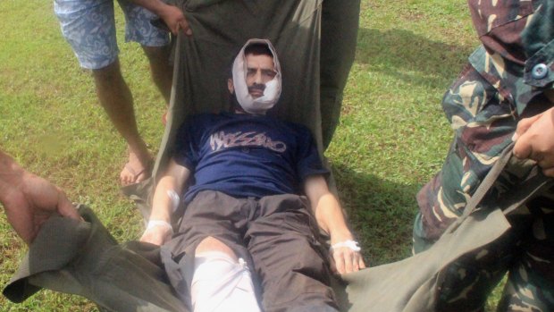 In this file photo, Swiss hostage Lorenzo Vinciguerra is rushed to a hospital following his escape from the hands of the Muslim Abu Sayyaf extremists, in Jolo in southern Philippines on December 6, 2014.