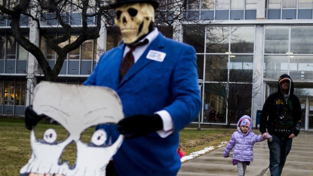 Flint residents protest outside City Hall.