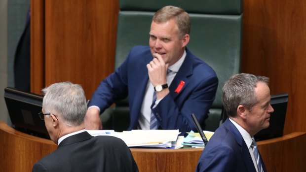 Opposition Leader Bill Shorten passes Prime Minister Malcolm Turnbull to vote against the plebiscite bill on Thursday.