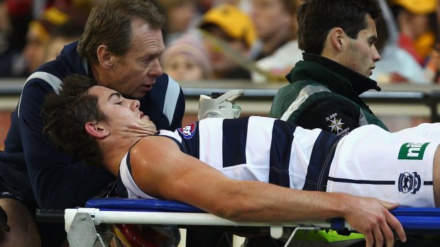 Daniel Menzel is stretchered off in the final against Hawthorn.