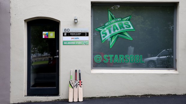 Outpouring of grief: Cricket bats outside the Melbourne Stars head office in East Melbourne stand in tribute to Phillip Hughes.