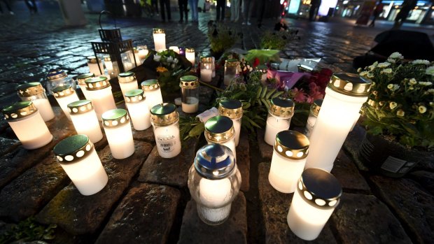 Memorial candles at the Market Square for the victims of Friday's stabbings in Turku, Finland.
