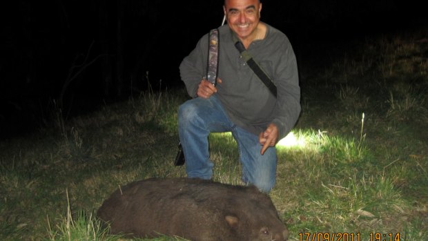 Tony Azzi with a dead wombat.