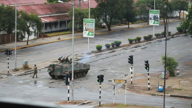 A tank is seen with armed soldiers on the road leading to President Robert Mugabe's office in Harare, Zimbabwe.
