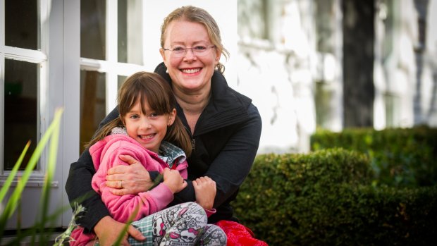 Canberra breast cancer survivor and photographer Marina McDonald with daughter Sydney Dayal, 7, at  home in Yarralumla.