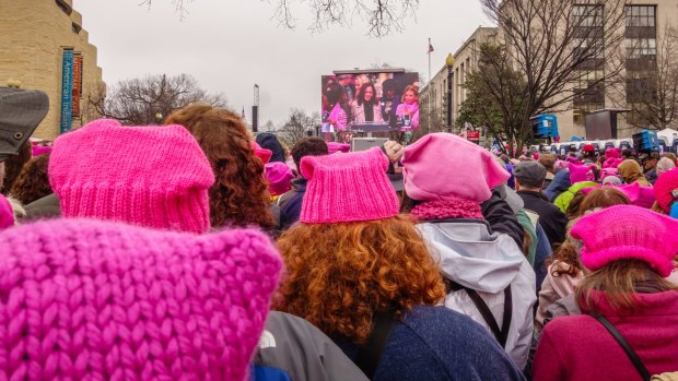 Women wearing knitted "pussy hats" to protest the election of Donald Trump.