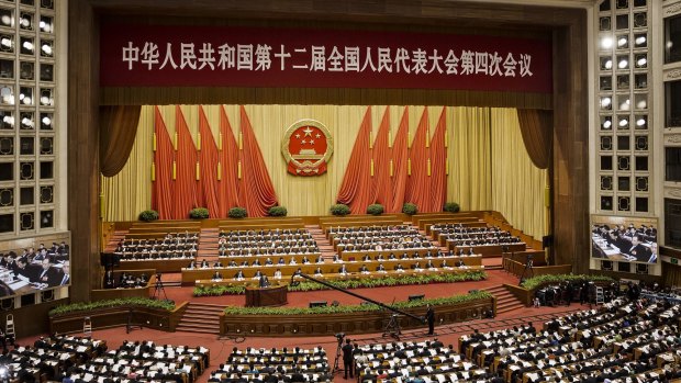 Delegates at National People's Congress (NPC) at the Great Hall of the People in Beijing. Forty-five members have been expelled after allegations of vote-buying.  