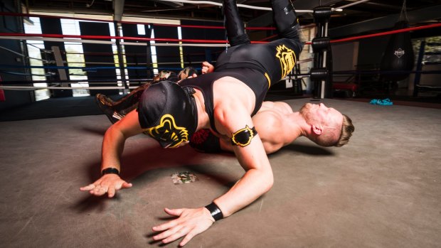 Wrestler Luke Bernie aka The Jaguar Kid body slams friend and fellow Canberran Kane Broadrick aka Mikey Broderick.