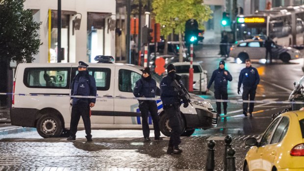 Lockdown in the streets, humour in the tweets: Belgian authorities conducted 22 anti-terror raids on Sunday, arresting 16.
