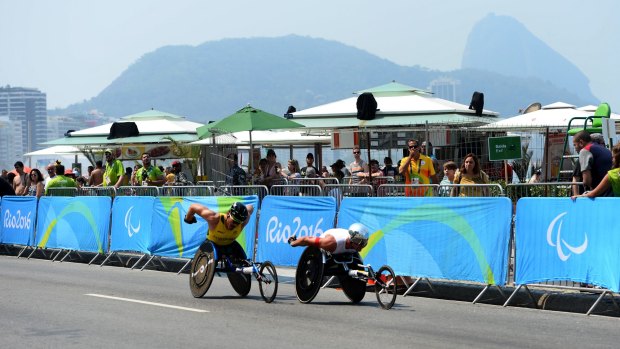 Kurt Fearnley and Marcel Hug split from the pack early.