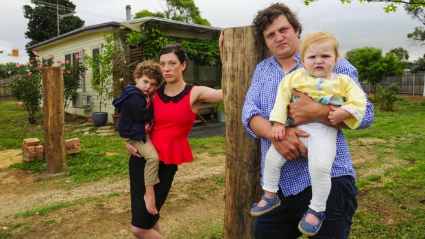Contaminated home: Bungendore Fluffy house owners Eddie Casey and and partner Dale Freestone with their children Leon, 3, and Grace, 1. Mr Casey gave a submission to the NSW inquiry.