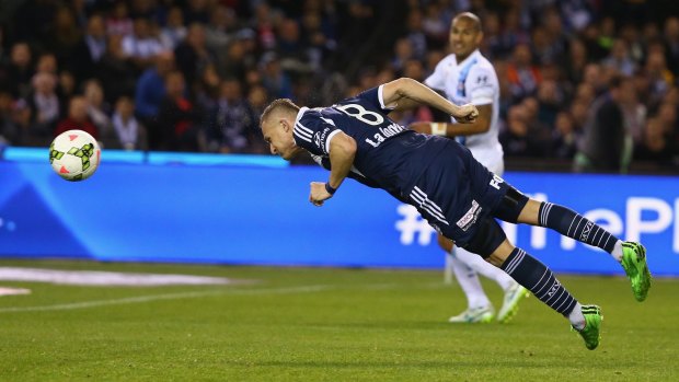 Victory's Besart Berisha heads home to open the scoring for Melbourne Victory against Melbourne City on Friday.