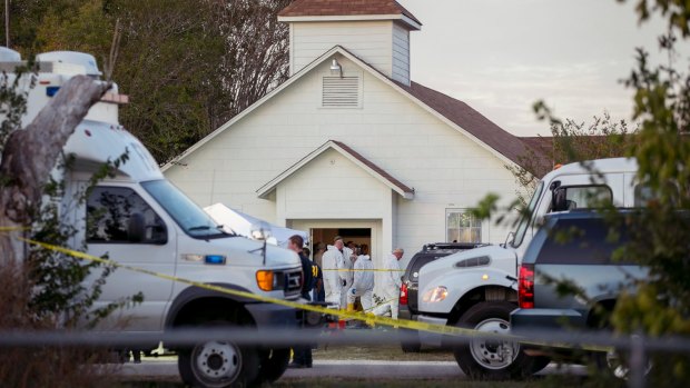 Investigators work at the scene of the deadly shooting at the First Baptist Church in Sutherland Springs, Texas.