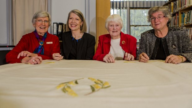 The ACT Embroiders Guild has embroidered a baby blanket that will be given to the new royal baby. From left, Embroider's Audrey Schultz, Lesley Fusinato, Marjorie Gilby, and Jan Hure.