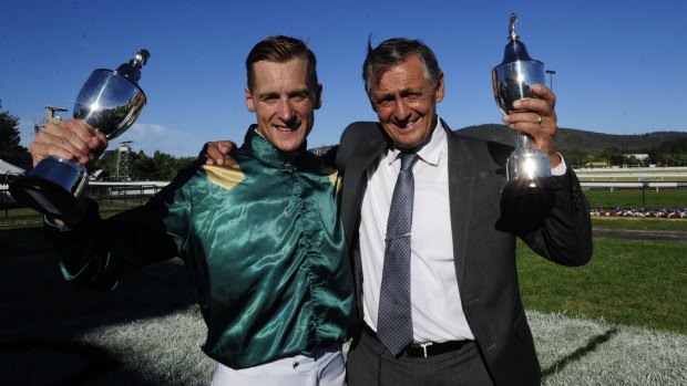 Jockey Blake Shinn and trainer Peter Snowden celebrate Defcon's win in the Black Opal Stakes.