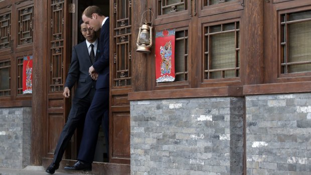 Prince William, right, and Matthew Hu, in Shijia Hutong in Beijing on Monday.