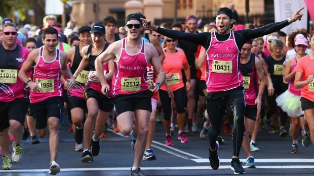 Canberra's Mick Spencer (centre, to the left of Jason Dundas, who has arms stretched out) completing a half-marathon for charity. Mick has two serious heart conditions but competes in sports where he can exert some control over his heart rate.