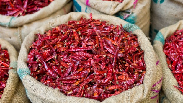Scientists are investigating how chillies may help to discourage overeating.