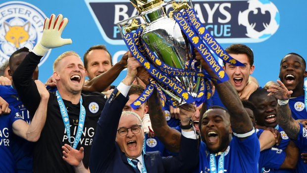 Foxes celebration:  Captain Wes Morgan and manager Claudio Ranieri  lift the Premier League Trophy.