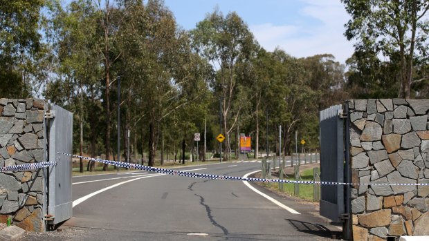 Police cordon off the entrance to Lizard Log Park, Wetherill Park following the shootings.
