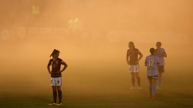 SYDNEY, AUSTRALIA - DECEMBER 30: Smoke from a flare blankets the pitch during the round nine W-League match between Western Sydney and Sydney at Popondetta Park on December 30, 2016 in Sydney, Australia. (Photo by Jason McCawley/Getty Images)