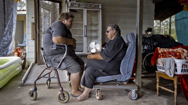 Watching the wheels: Colin and Des Spackman at their Queensland home. 