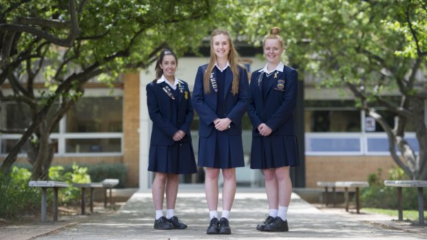 Merici College students Tahlia Low, Grace Cooper and Rose Mackay.