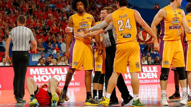 Big hit: Josh Childress is restrained after fouling the Perth Wildcats' off the ball at Perth Arena.