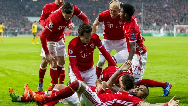 Bayern celebrate their fourth goal.