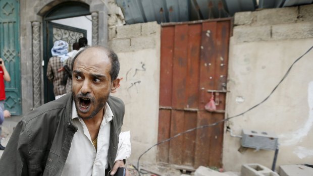 A man reacts at the site of an air strike in the Yemeni capital Sanaa this week.