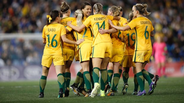 Good as gold: Matildas players celebrate Sam Kerr's first goal on Tuesday.