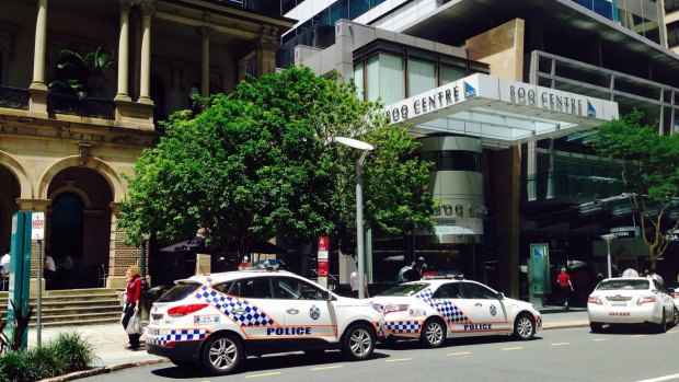 Police at the QCAT court in Brisbane's CBD after the discovery of white powder.