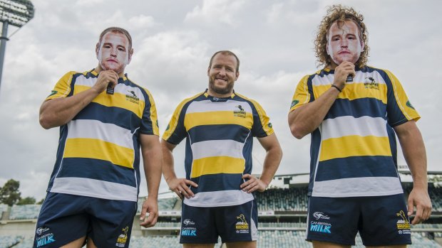 Brumbies players Ruan Smith and Jean-Pierre Smith wear Ben Alexander face masks ahead of Alexander's 100th match. 