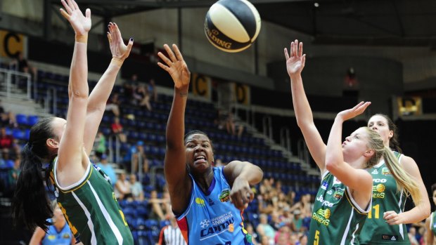Canberra Capitals  player Denesha  Stallworth fights for a loose ball against Dandenong last week. 