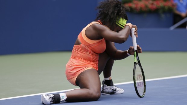Down and out: Serena Williams reacts after losing a point to Roberta Vinci.