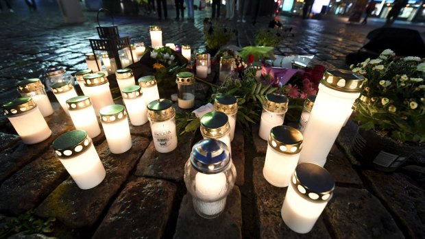 Memorial candles at the Market Square for the victims of Friday's stabbings in Turku, Finland.