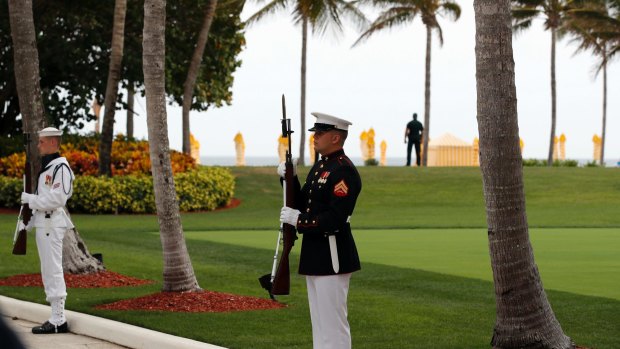 Military personnel stand for the arrival of Chinese President Xi Jinping and his wife Chinese First Lady Peng Liyuan at Mar-a-Lago on April 6.