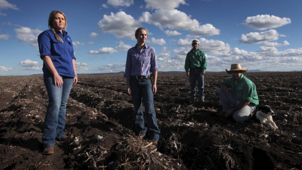 Sarah Hubbard, Maddy Coleman, Jock Tudgey and Hugh Pursehouse stand on the soil of Breeza Station in the Liverpool Plains, which could be impacted by mining in the future.